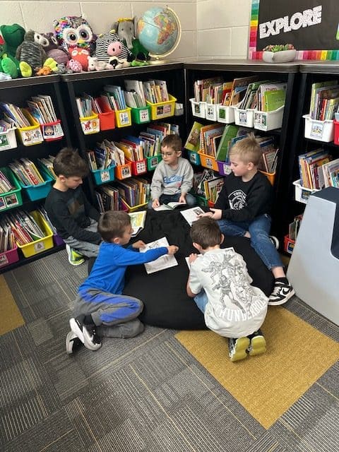 Students engaging in collaborative learning in the school library.