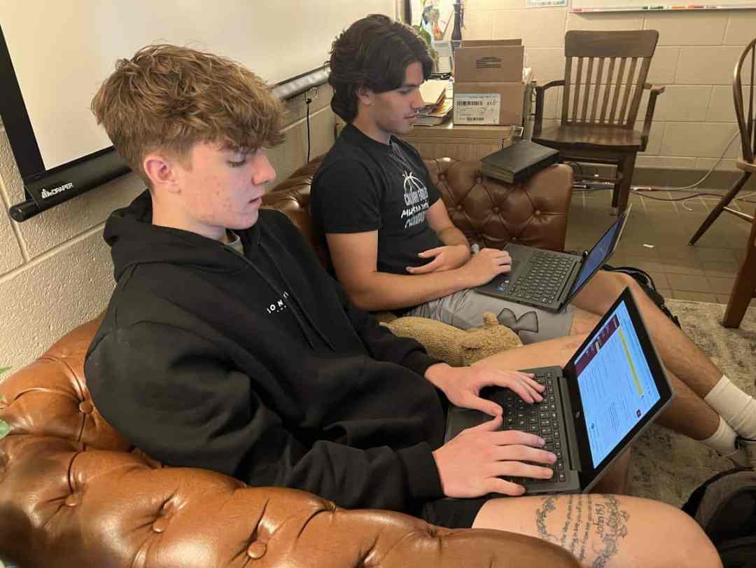 students using computers in class